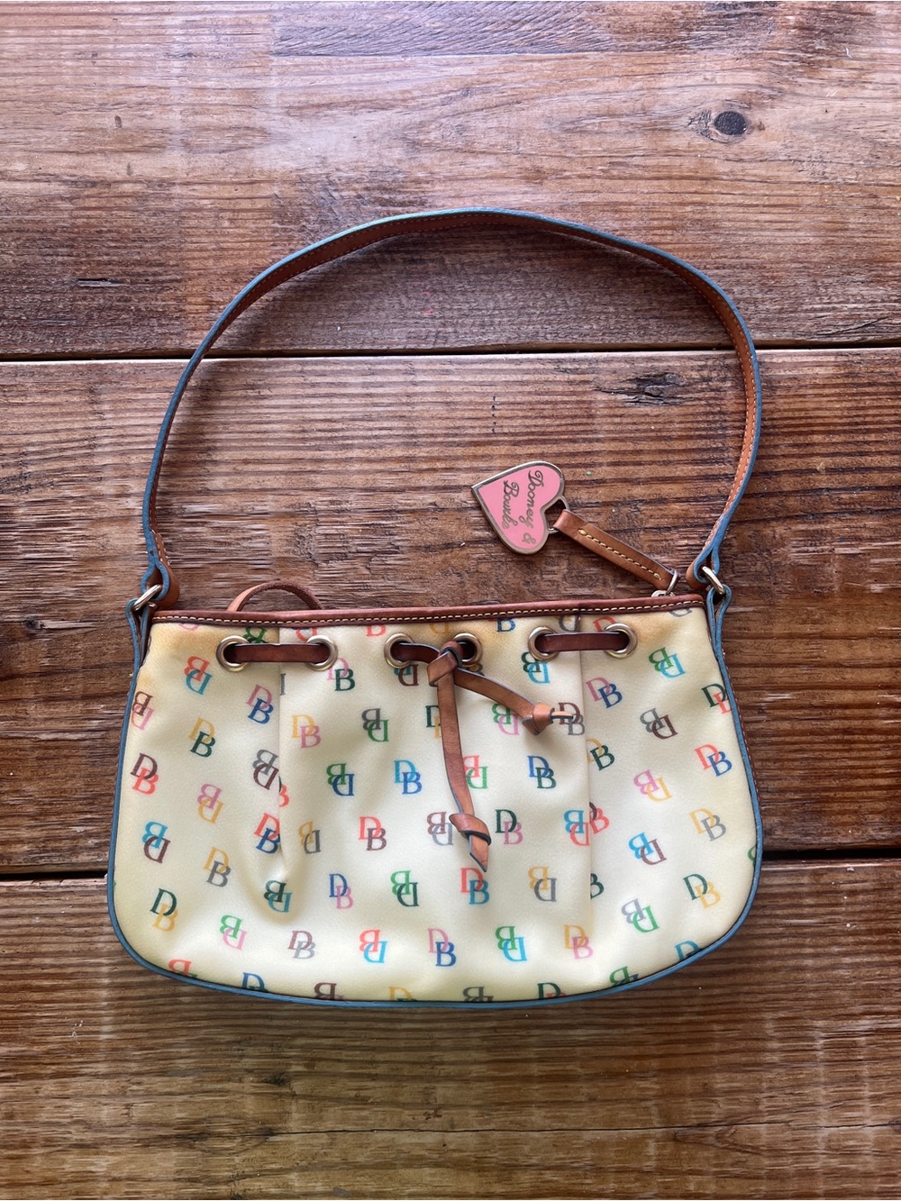 Dooney & Bourke Cream Multicolor DB Logo Drawstring Shoulder Bag
